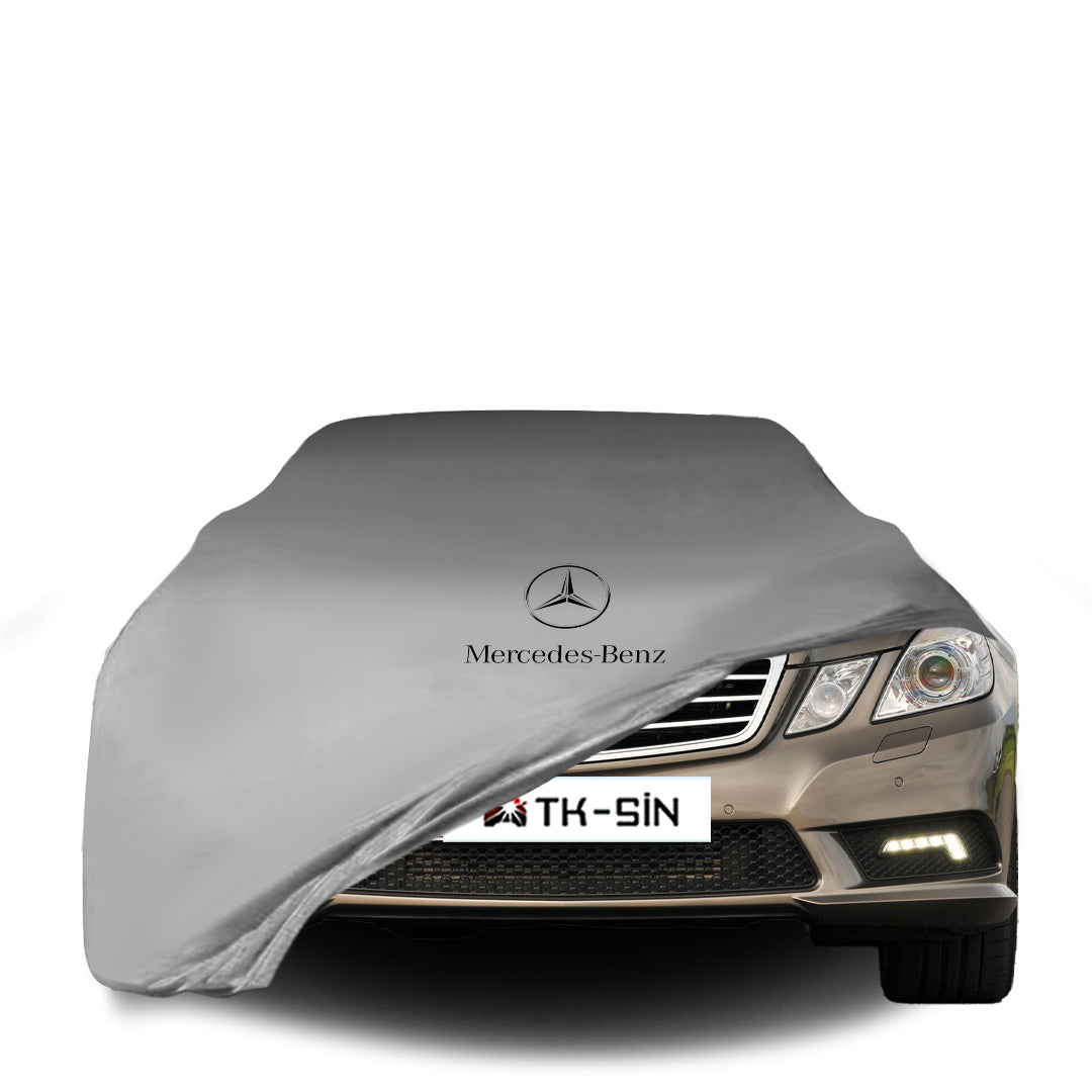 Mercedes-Benz E-Klasse (W212) mit maßgeschneiderter Indoor-Autoabdeckung in einer Garage in Deutschland